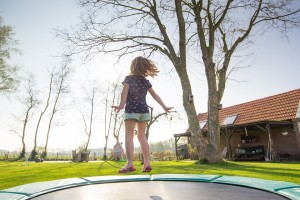 kid on trampoline